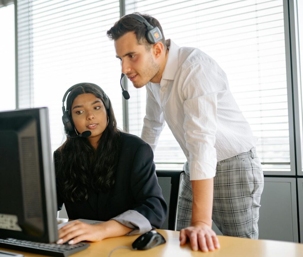 A Man and Woman Looking at the Computer Screen